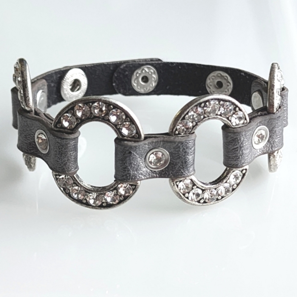 Retired vintage leather, silver rhinestone bracelet. Snap close adjustable.